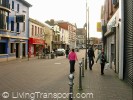 A short shopping street is pedestrianised, but doesn't attract sufficient footfall to justify it, and trade is sluggish