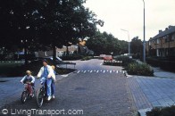 17. Heerde (Near Zwolle, Netherlands) national 30 zone demonstration project in low density housing area where through traffic now discouraged with frequent speed reduction measures. Slide shows offset crossroads with raised carriageway 