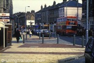 23. Wandsworth (South West London) Radial route with narrowed carriageway. Slide shows footway extension at side road junction with cast iron bollards to prevent pavement parking, defined parking bays. Ramped side road to slow speed of turning traffic, and to provide level crossing facility for pedestrians. Taken in 1990.