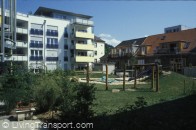 Car-reduced housing, T?bingen, Germany. The area is Franzosisches, a former barracks. Internal courtyards are semi-private and provide play areas.